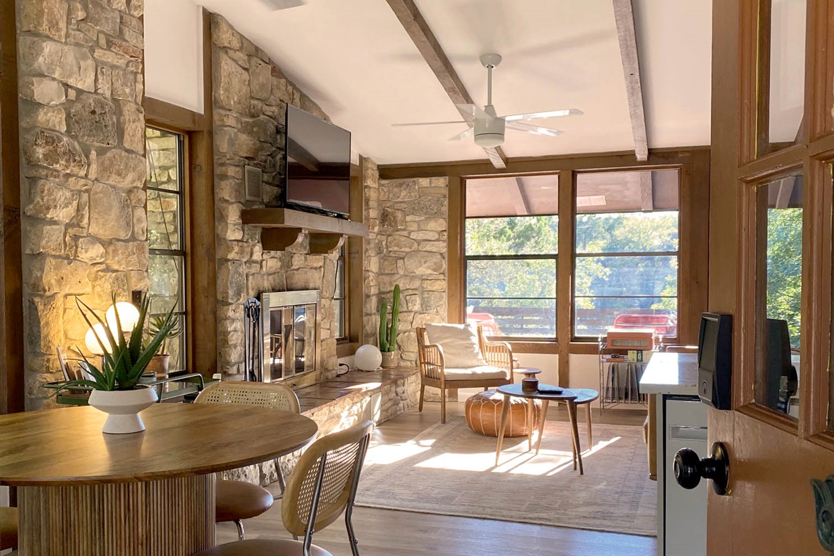 Open dining / living with full kitchen. Unobstructed views of Hill Country. AC + ceiling fans / central heat + wood burning fireplace.