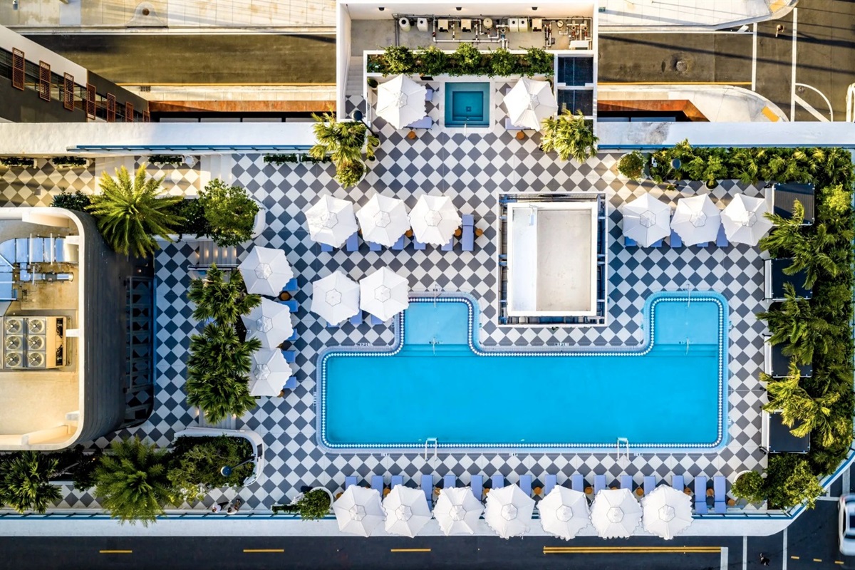 Rooftop oasis &mdash; heated lap pool with sun deck and Wynwood city panorama