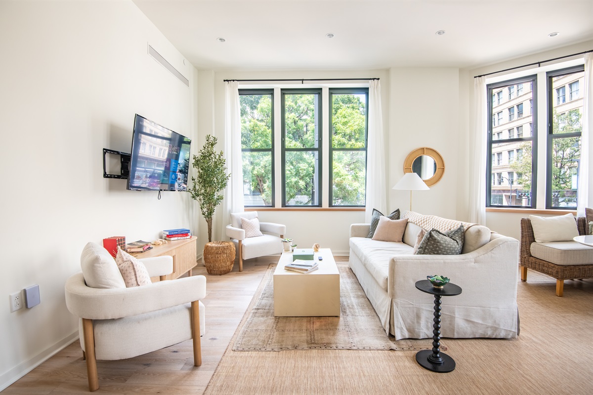 Comfortable living room with chic décor and large TV