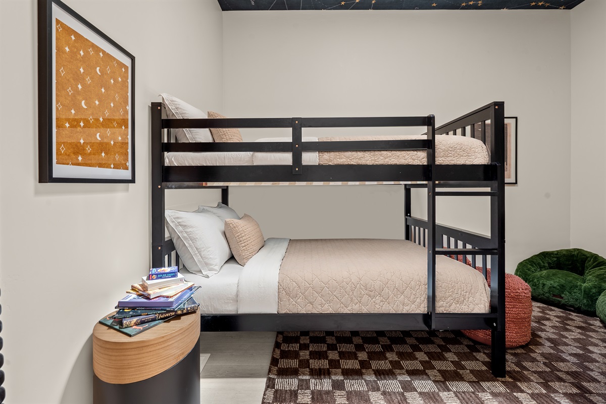 A magical space for the little ones. Our dedicated kids' bunk room features a fun stargazing theme, complete with starry ceiling wallpaper and a skylight to inspire sweet dreams.