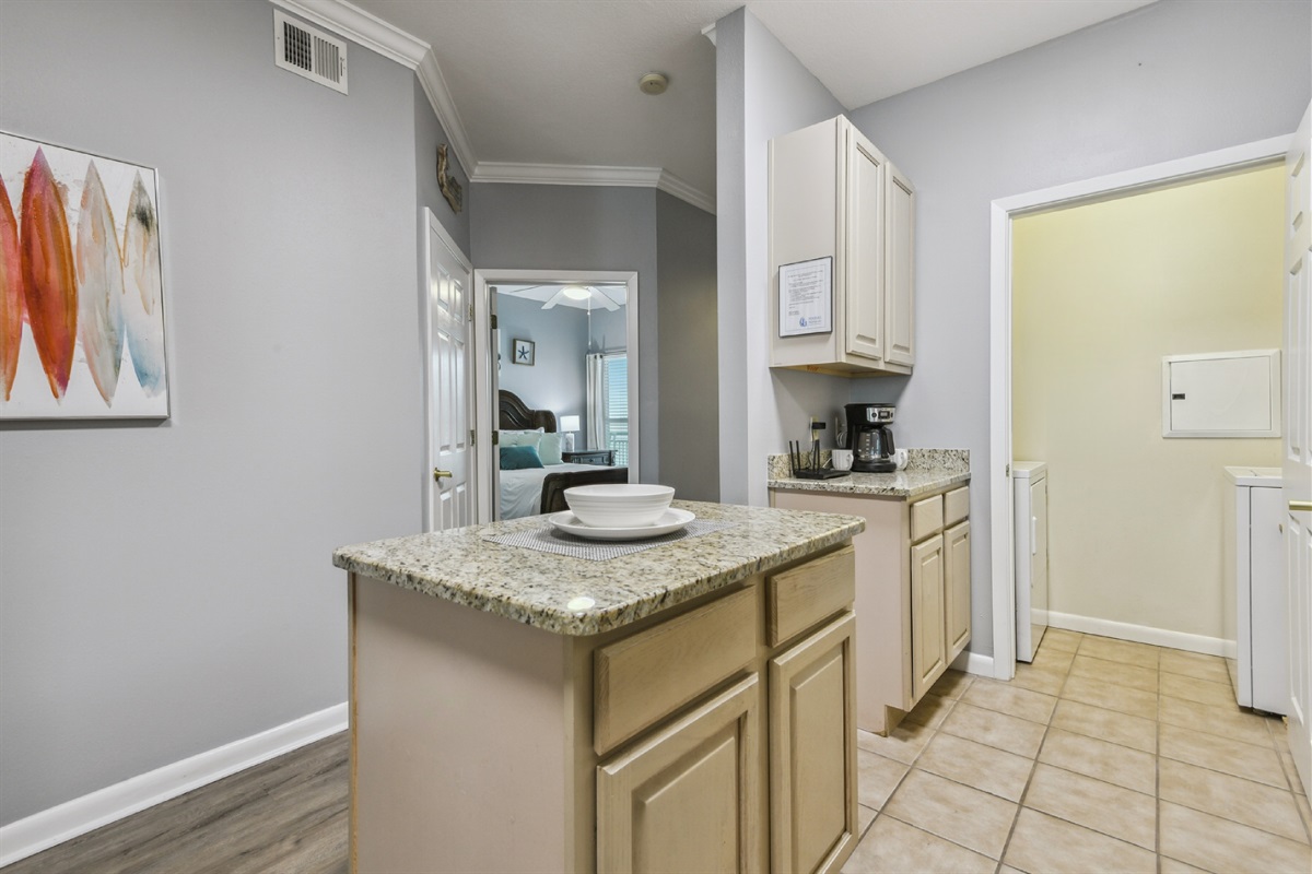 Looking into 2nd bedrooms, laundry, and hall from kitchen.