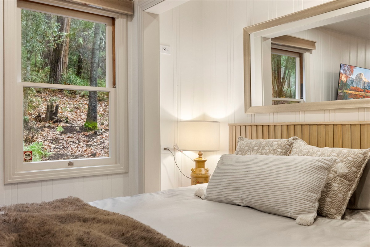 Serene master bedroom with a new memory foam queen mattress.