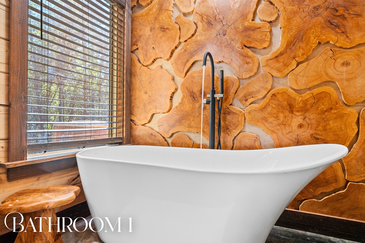 Luxurious bathroom with freestanding soaking tub and natural design.