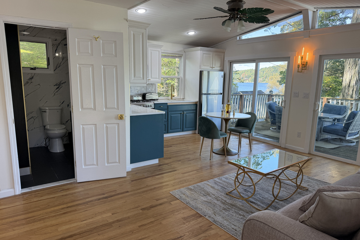 Spacious living area, bathroom on the left, deck on the right
