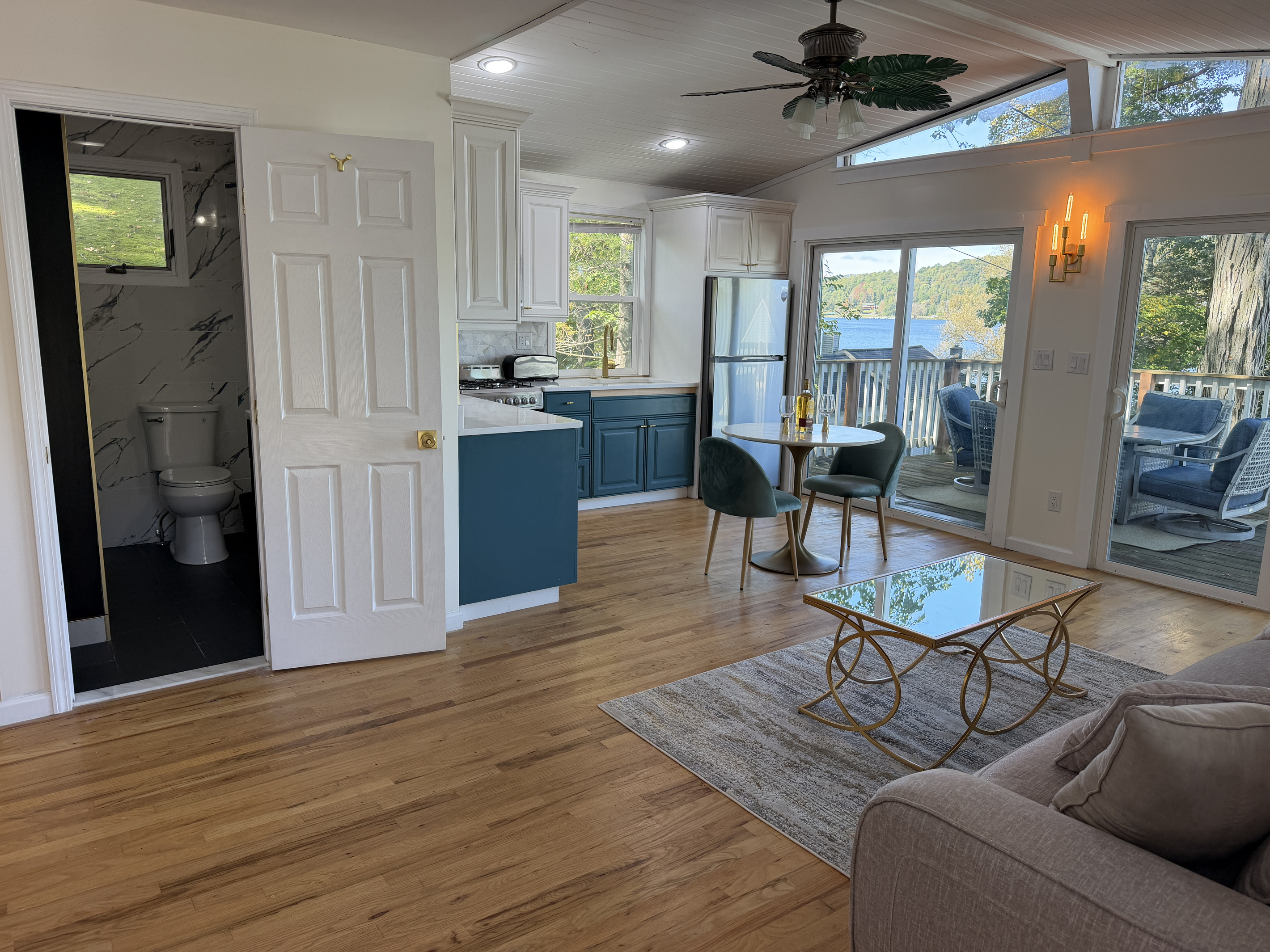 Spacious living area, bathroom on the left, deck on the right