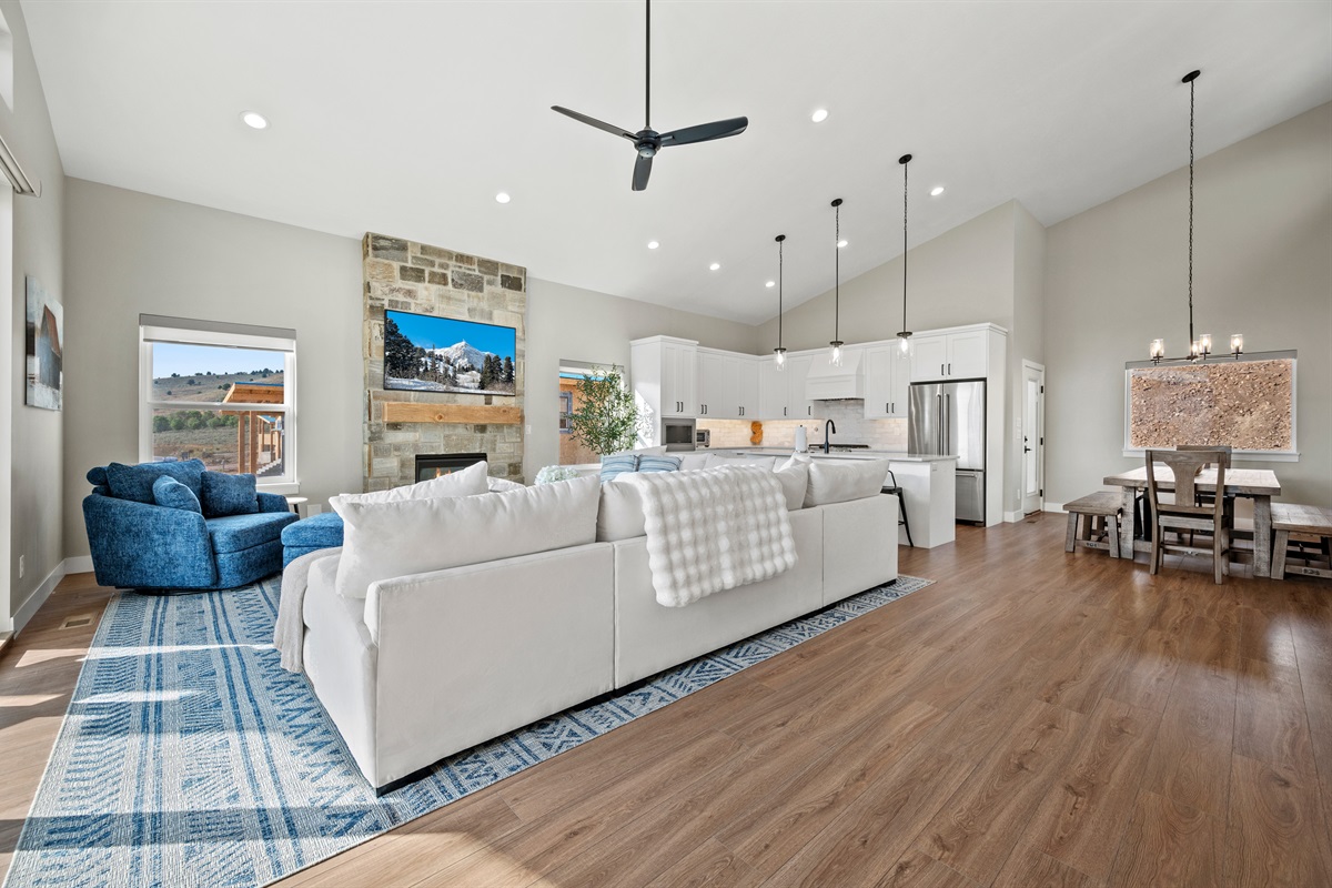 High ceilings, modern lighting, and open-concept design create a bright, airy gathering space.