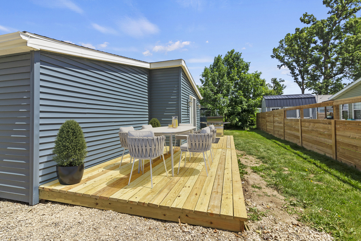 The Waterbury Way - Patio with outdoor dining and Blackstone grill