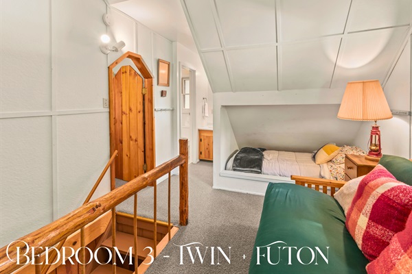 Bedroom 3 offers a twin bed and futon in a charming upstairs loft, perfect for reading or relaxing.