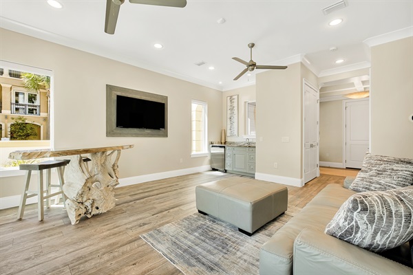 1st floor family room w/ teak bar and direct access to the private pool