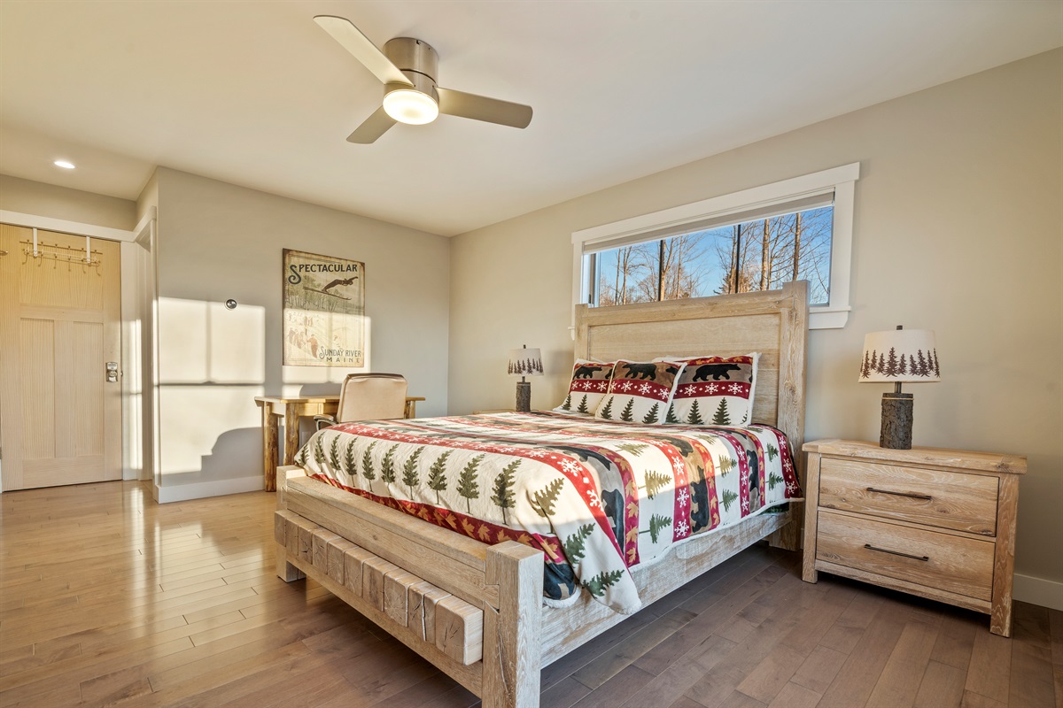Relax in a queen bedroom with a table and chair workspace