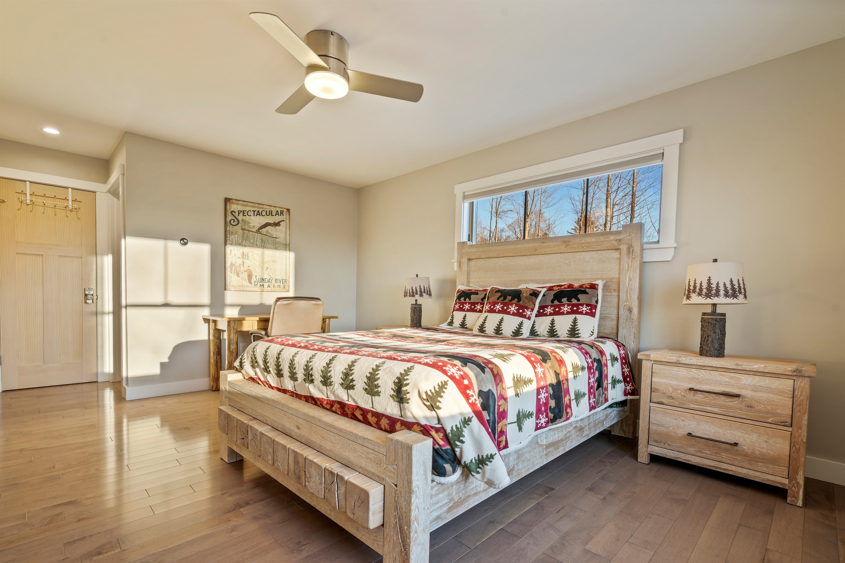 Relax in a queen bedroom with a table and chair workspace