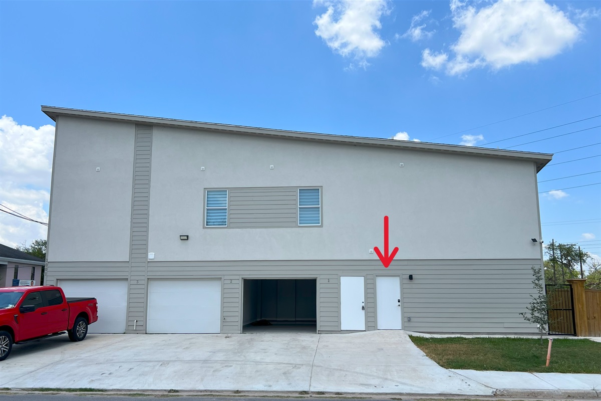 Building with Unit 1 Garage Open