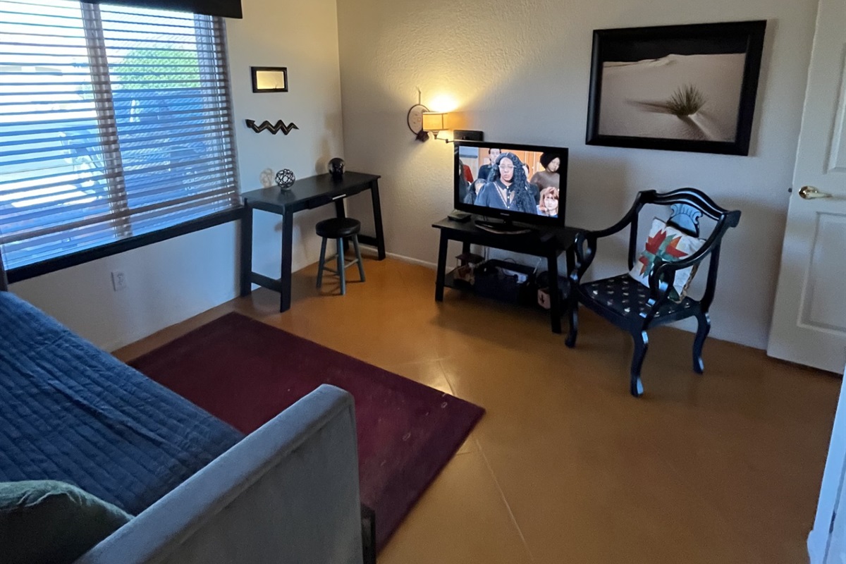 Desk and chair in the guest bedroom offers a work space