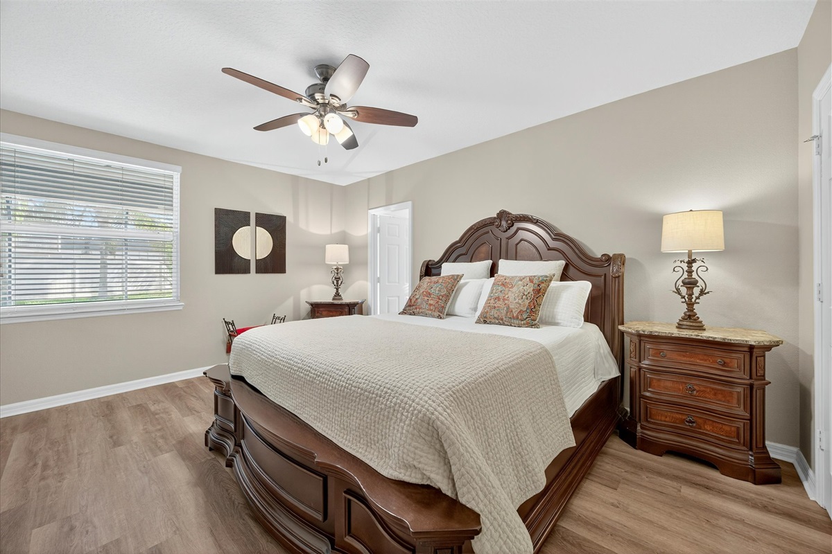 Primary suite with plush king bed, & ensuite bathroom.