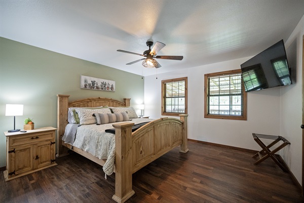 Master bedroom has a large king bed plus TV.