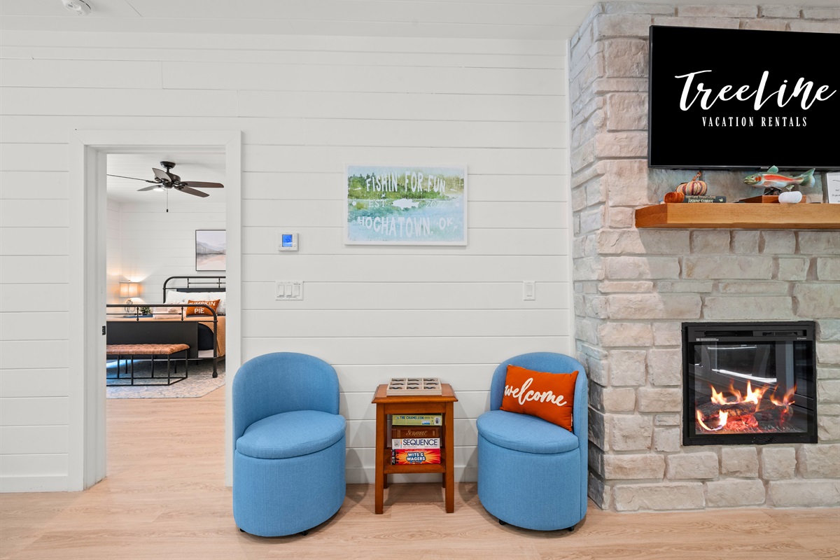 Cozy sitting area with fireplace for relaxing evenings.