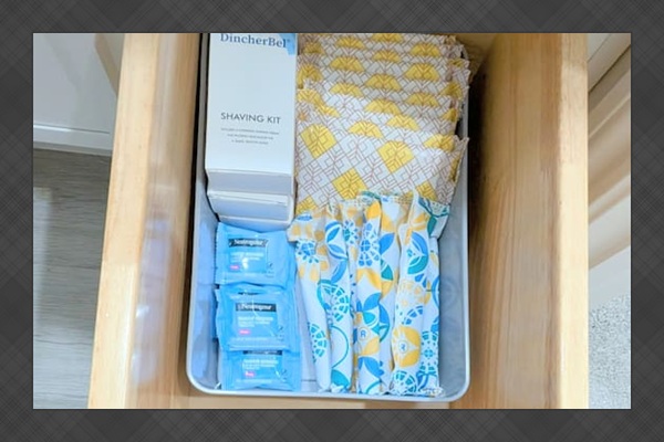 Extra toiletry items are stocked in the vanity. 