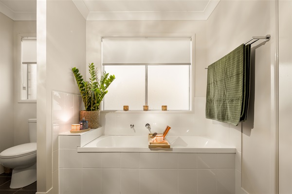 Relax in the spacious Master suite's private en-suite featuring a full-size bath