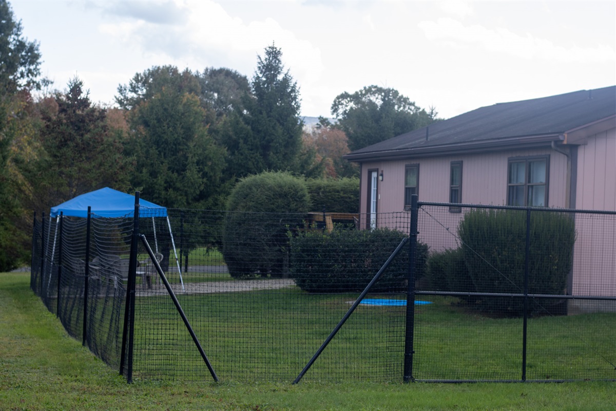 Fenced in yard totally secure for your pups free play.