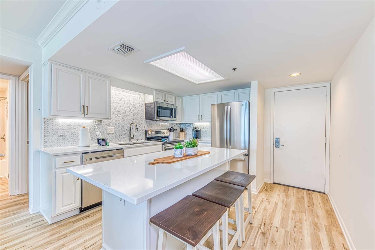 Kitchen Oasis: Modern design with sleek appliances and inviting bar seating for culinary adventures!