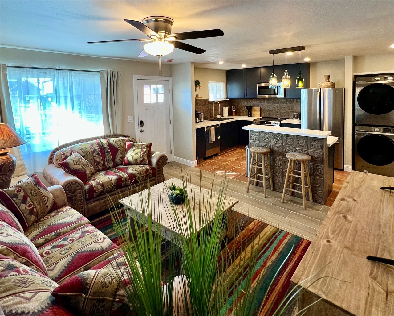 Relax in the spacious, open-concept living room, flowing right into a modern, fully-equipped kitchen. Perfect for gathering!