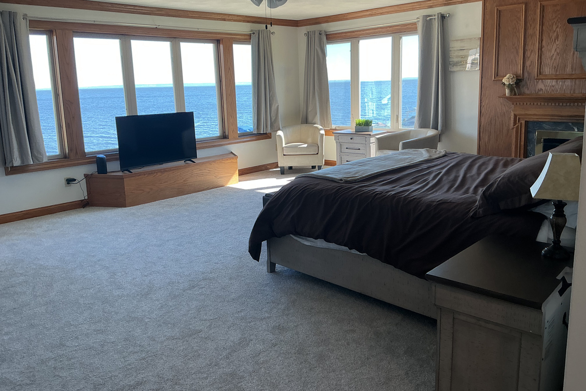Master bedroom with stunning Lake Winnebago views!