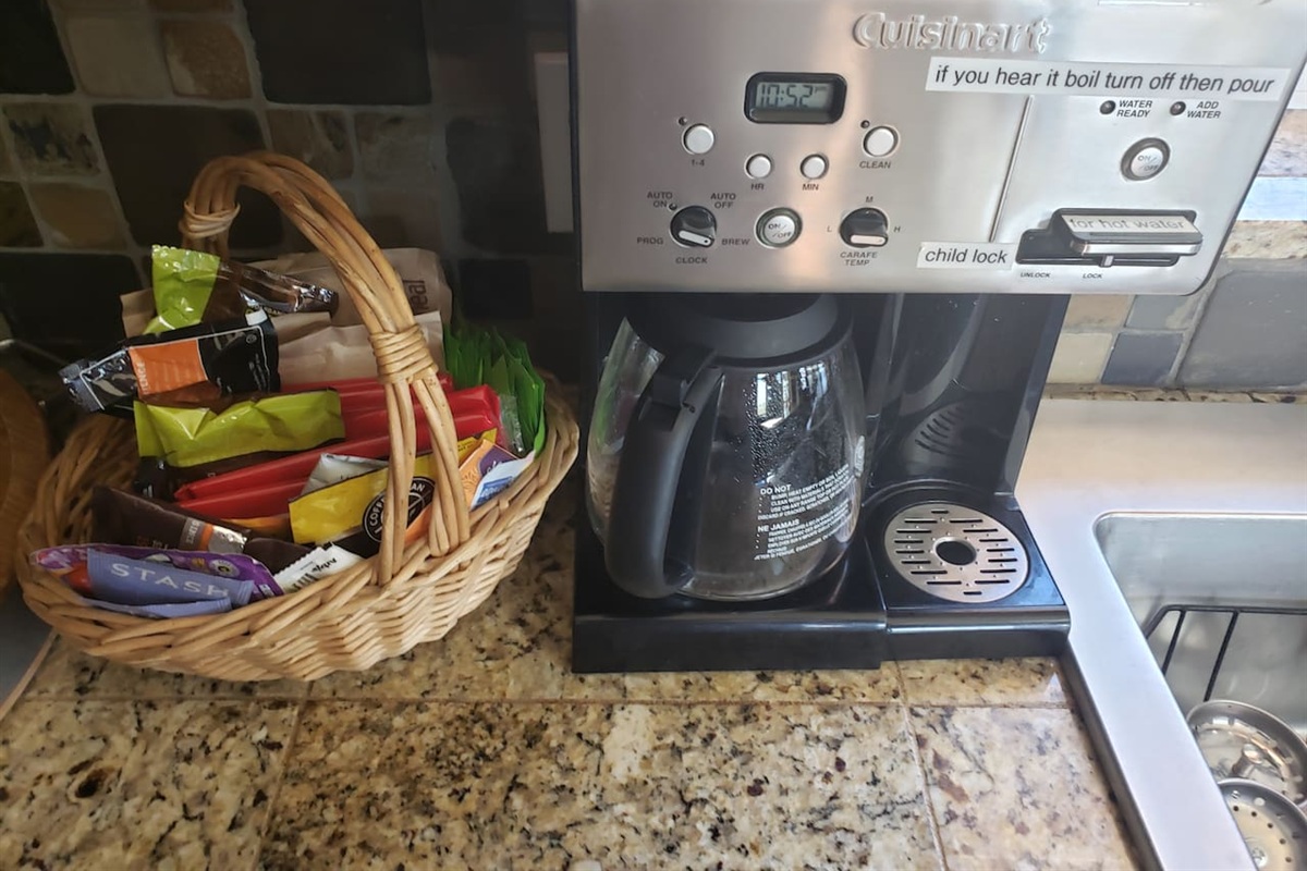 Standard coffee maker (has reusable gold filter) with hot water function for the hot tea drinkers.  An assortment of items you may have forgotten is provided "just in case".