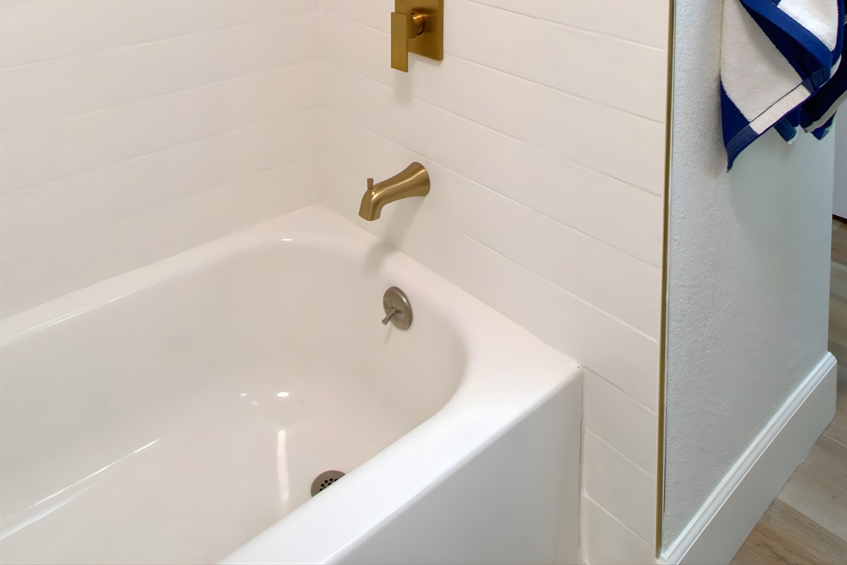 Second bathroom features a tub and a shower