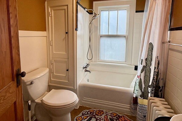 Updated shower fixtures with good water pressure, plus built-ins for towels and bathroom essentials.