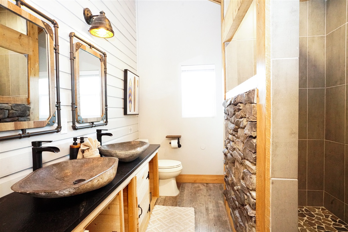 The master bedroom and bedroom two share a dual vanity bathroom.