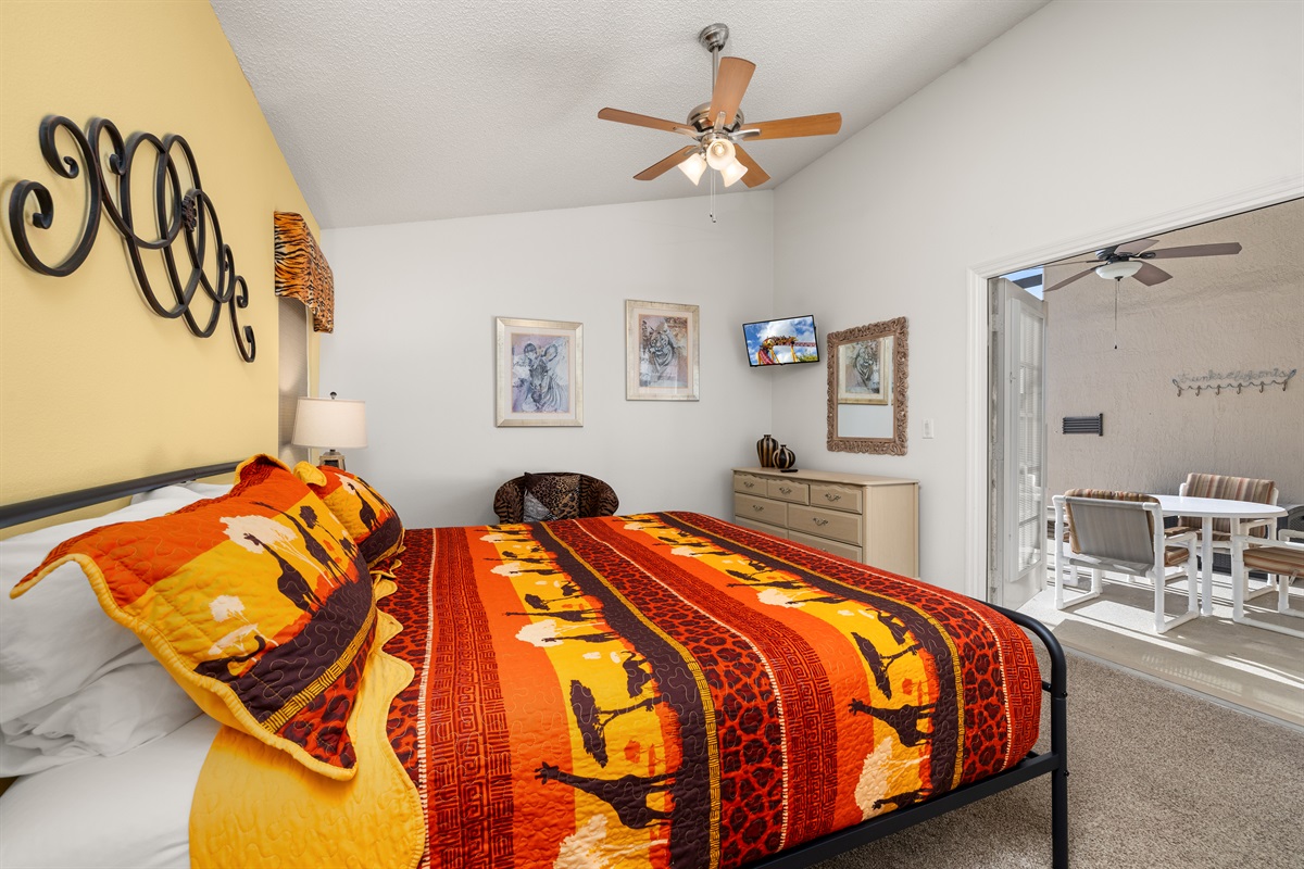 Enjoy the wall mounted TV and the french doors to the lanai in king suite.