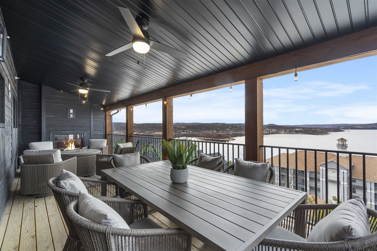 Main level deck with electric fireplace and propane grill