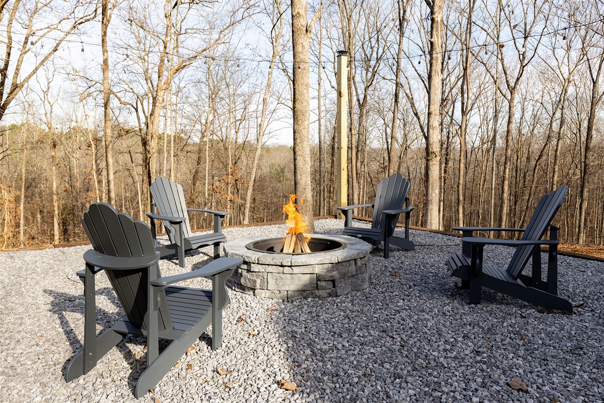 Gather around the private fire pit with comfortable seating, surrounded by peaceful woods—perfect for morning coffee, sunset conversations, or cozy evenings under the stars