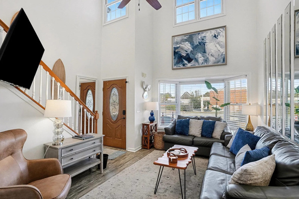 Sunlit living room with plush seating and coastal decor — your North Myrtle Beach home base