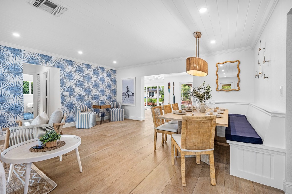 Seamless indoor flow connects living and dining areas, blending breezy coastal design with effortless comfort and style.