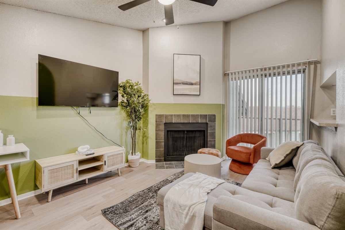 Stylish and cozy living space with a warm fireplace.