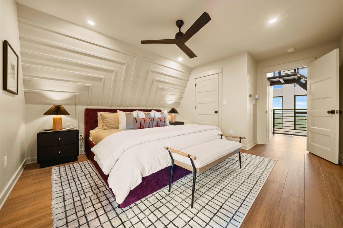 A second view of this bedroom shows off the roomy layout and calming design, making it a great spot to recharge between adventures.