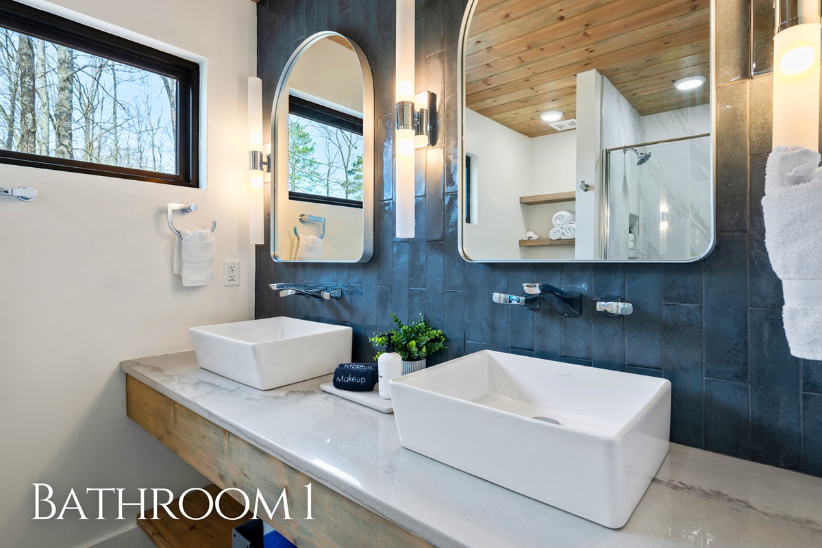 The bathroom features a clean and modern design with plenty of space, making it easy to get ready while still feeling relaxed.