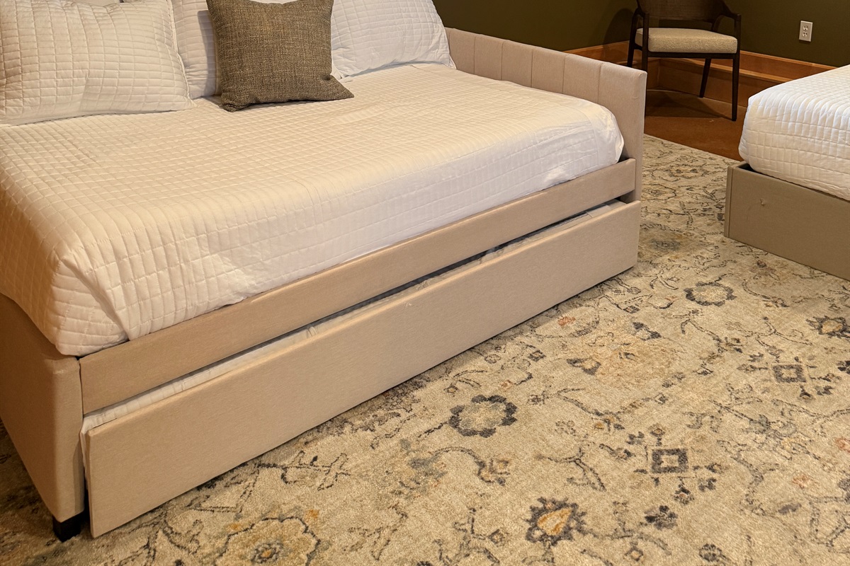 The full daybed in the second bedroom on the main level is a full daybed with a single trundle, allowing sleeping space for 3 people