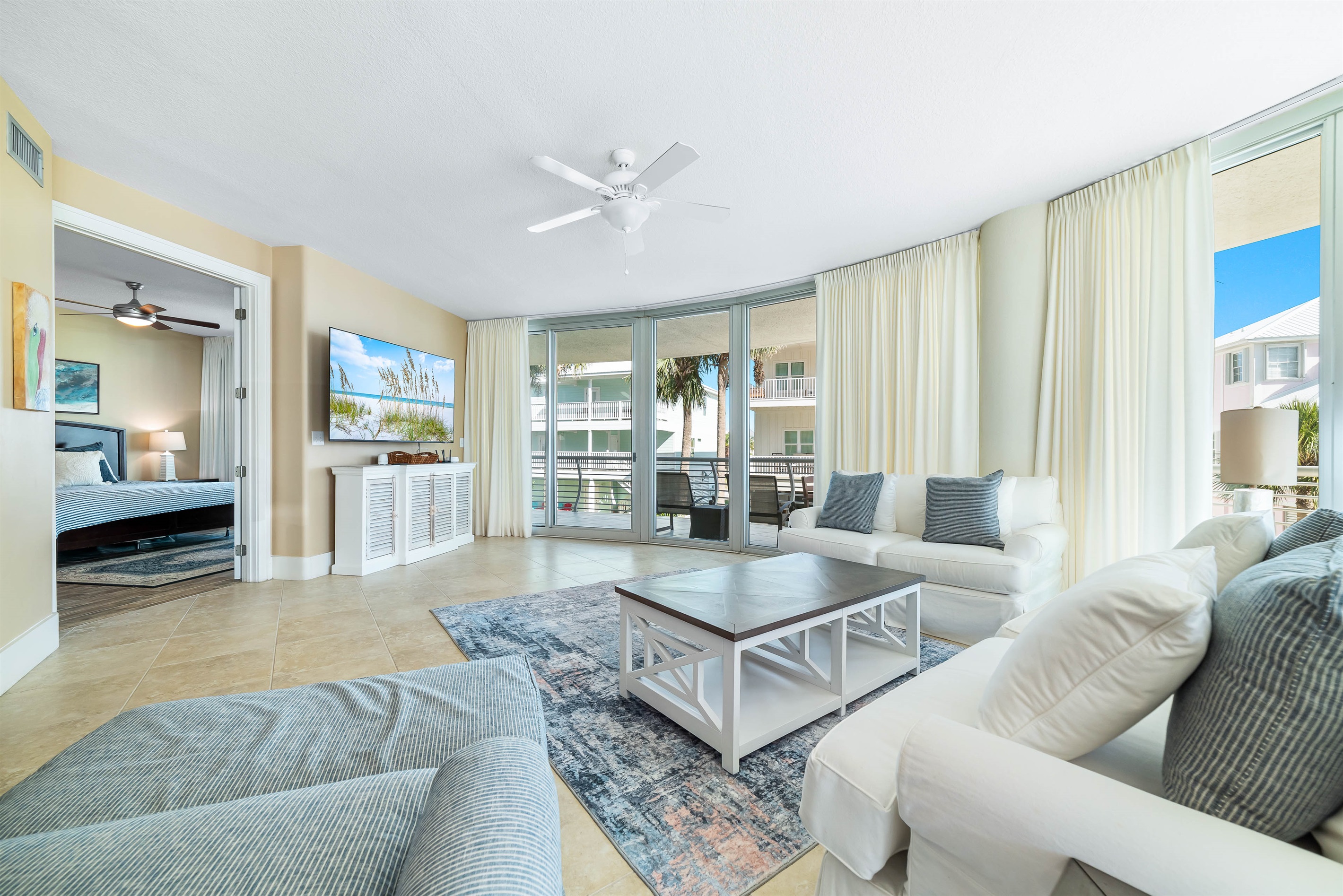 This thoughtfully designed living space maximizes natural light and integrates seamlessly with the surrounding environment. The open-concept layout and expansive windows create a bright and airy atmosphere.