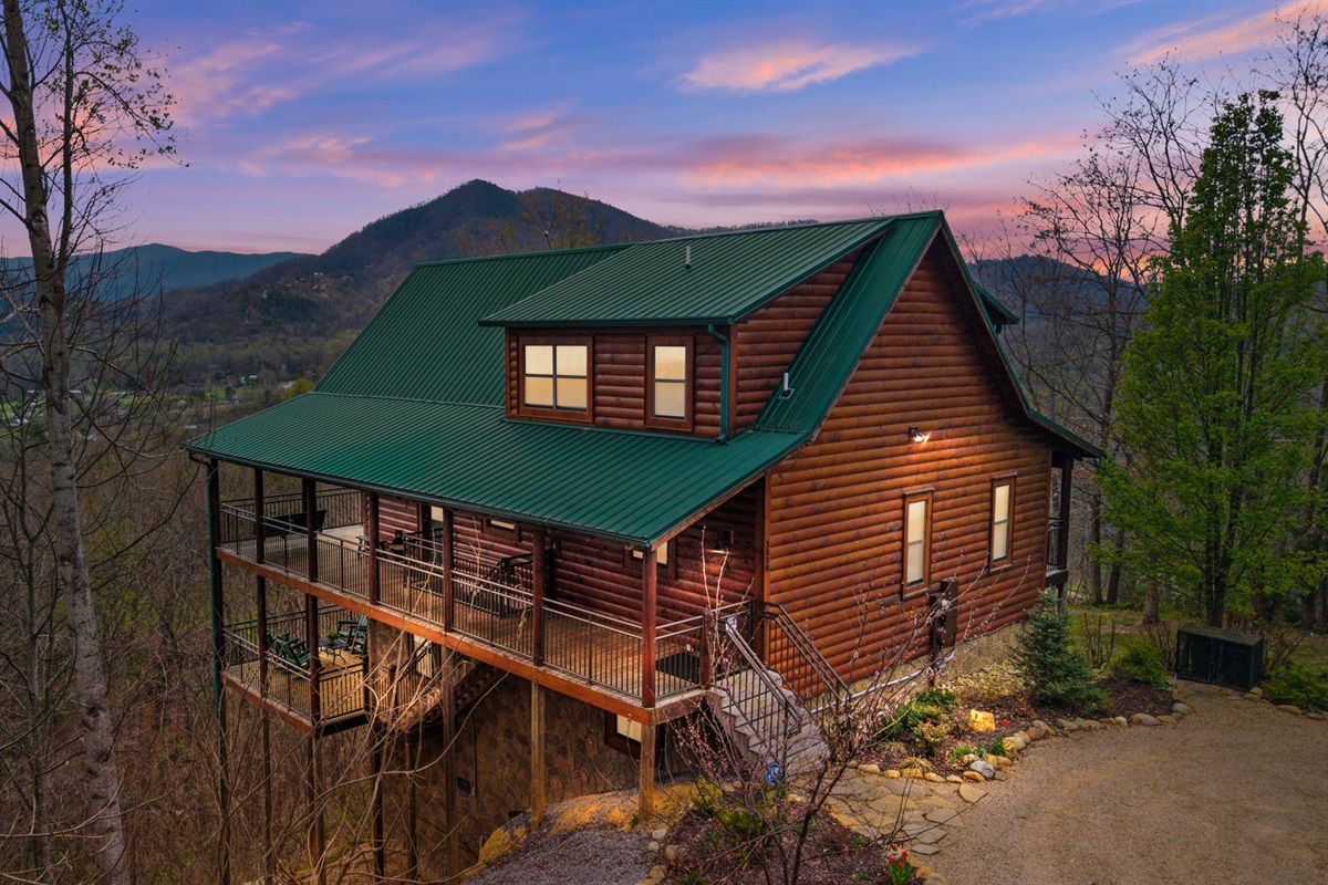 Evenings here feel different—sunset over the Smokies from your private cabin.
