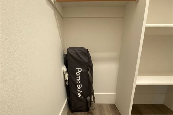 Portable crib in master closet
