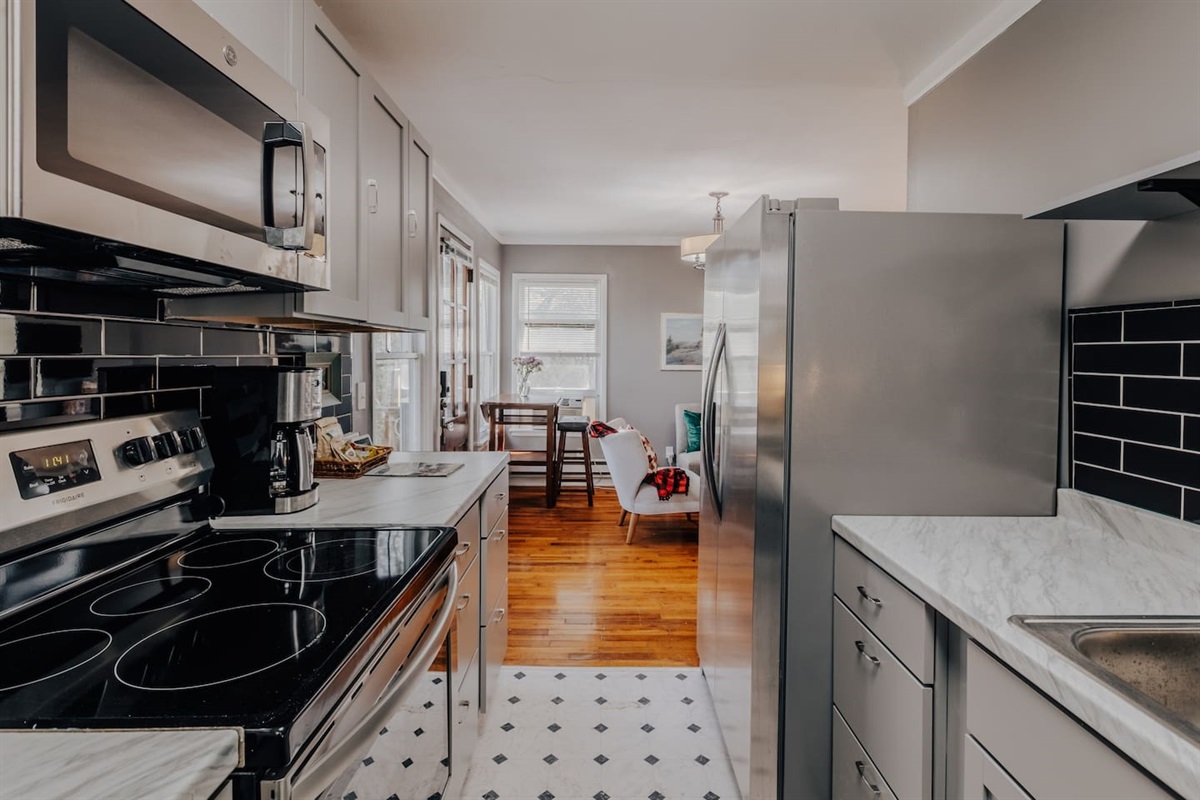 house 1 kitchen, just renovated with frig, stove. microwave. cook top and fully stocked with cookingware