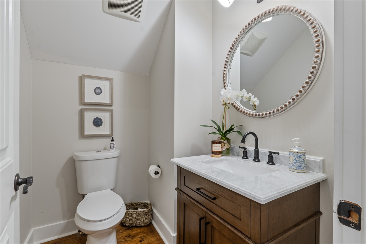 Convenient half bath located on the main floor, perfect for guests and easy access from the main living areas.
