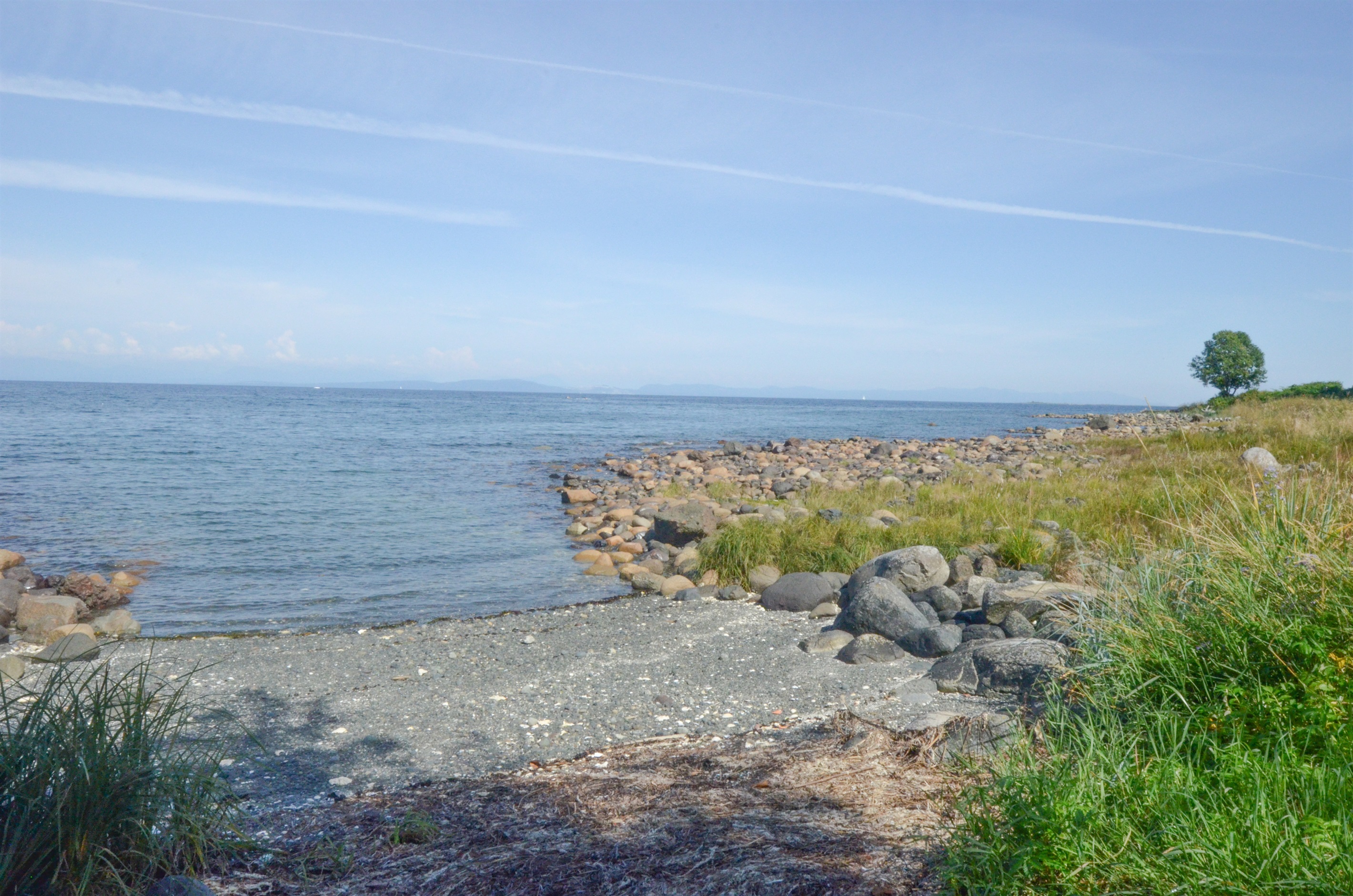 Private rocky beach just steps away — walk to Kingfisher Spa