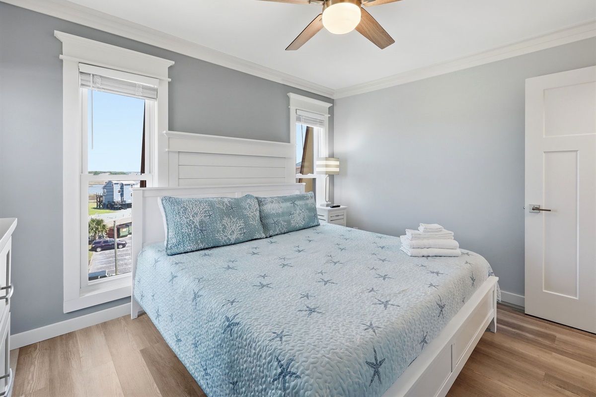 Relax in the bright and airy second king bedroom