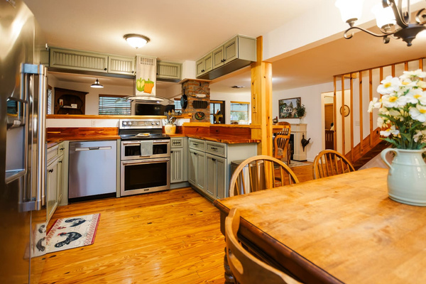 The chef's kitchen - double ovens, butcher-block counters, and room for the whole familty.