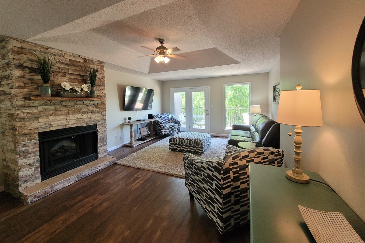 Cozy up by the fireplace and enjoy your favorite shows ine one of the two living rooms with HD TV