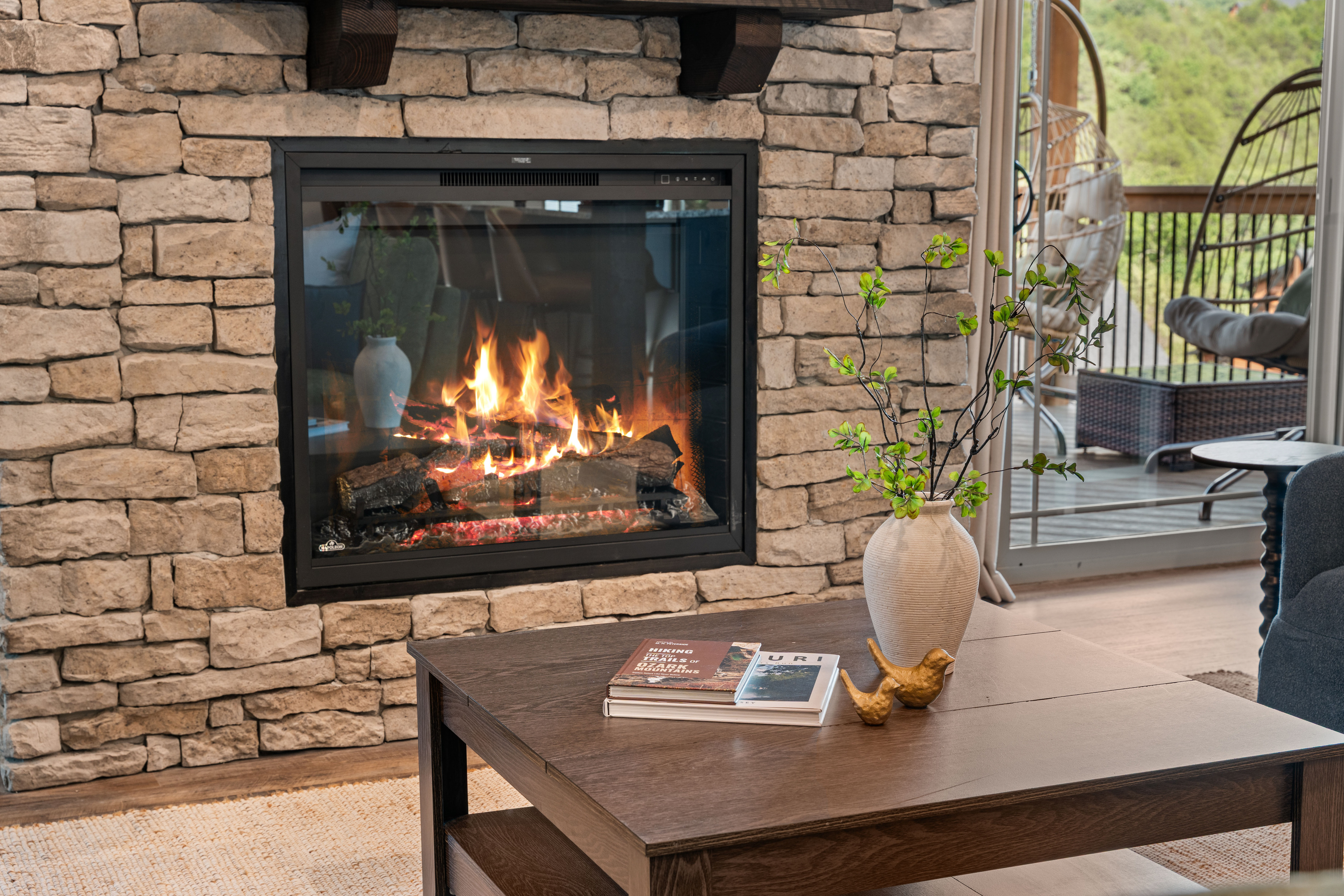 Warm up by the stacked-stone gas fireplace, local Ozark hiking guides stacked and ready for your Branson adventures.