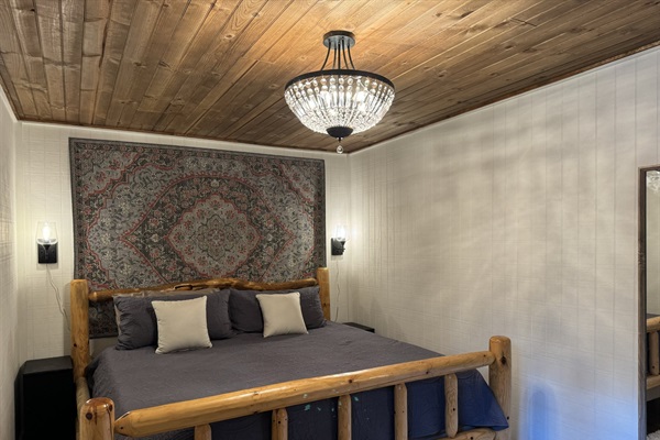 King bedroom with full length mirror and Television